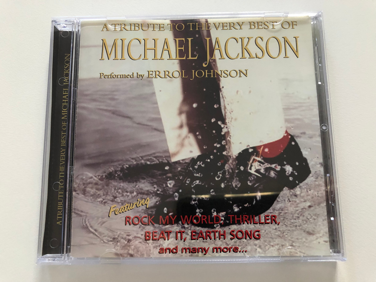 https://cdn10.bigcommerce.com/s-62bdpkt7pb/products/30952/images/182507/A_Tribute_To_The_Very_Best_Of_Michael_Jacskon_-_Performed_by_Errol_Johnson_Featuring_Rock_My_World_Thriller_Beat_It_Earth_Song_and_many_more..._SP._Series_Audio_CD_SP089-2_1__45379.1624554050.1280.1280.JPG?c=2