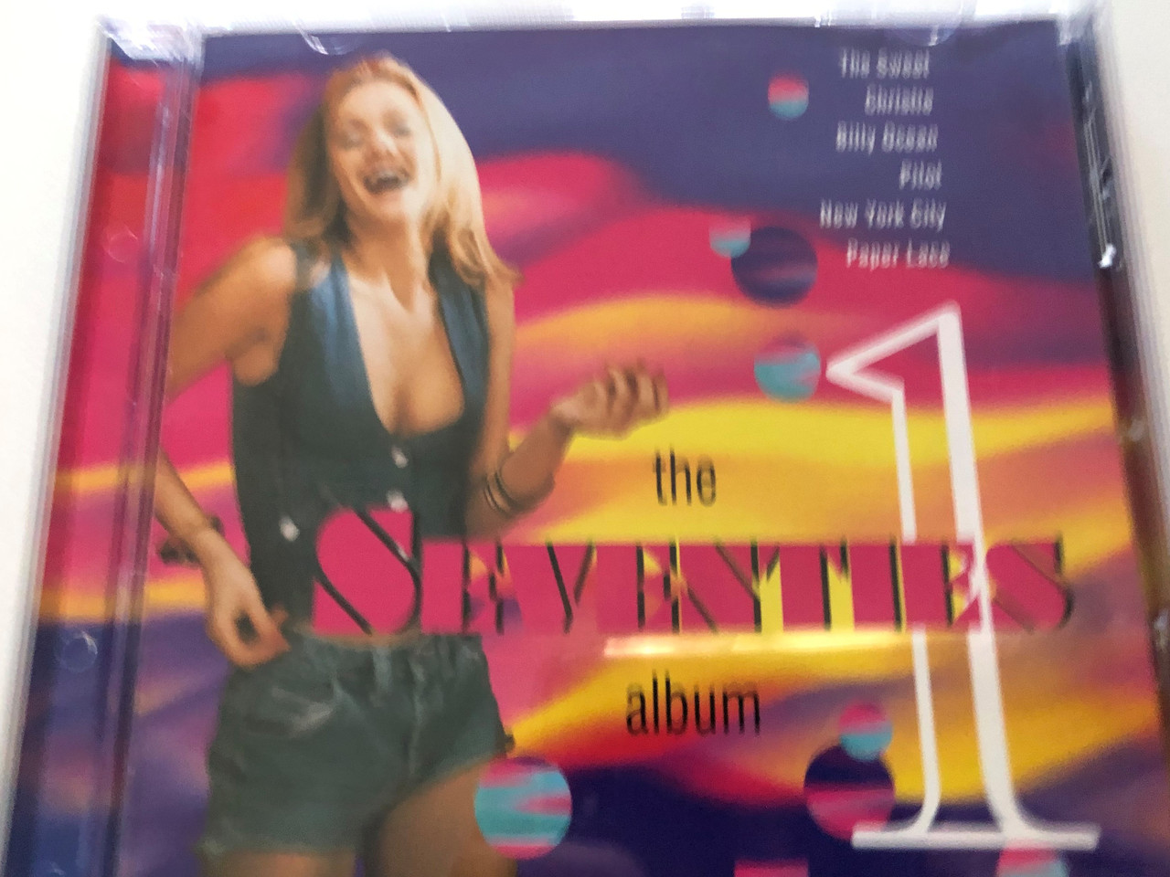 https://cdn10.bigcommerce.com/s-62bdpkt7pb/products/30956/images/182526/The_Seventies_Album_1_The_Sweet_Christie_Billy_Ocean_Pilot_New_York_City_Paper_Lace_Cedar_Audio_CD_GFS009_1__40445.1624558653.1280.1280.JPG?c=2