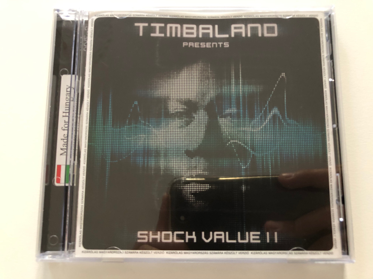 https://cdn10.bigcommerce.com/s-62bdpkt7pb/products/30981/images/182653/Timbaland_Presents_-_Shock_Value_II_Made_In_Hungary_Blackground_Records_Audio_CD_2009_060252729642586__48445.1624609228.1280.1280.JPG?c=2