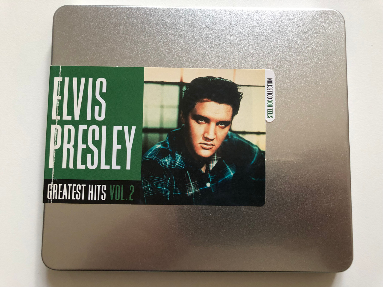 https://cdn10.bigcommerce.com/s-62bdpkt7pb/products/31019/images/182837/Elvis_Presley_Greatest_Hits_Vol.2_Steel_Box_Collection_Sony_Music_Audio_CD_2009_88697627562_1__43437.1624947747.1280.1280.JPG?c=2