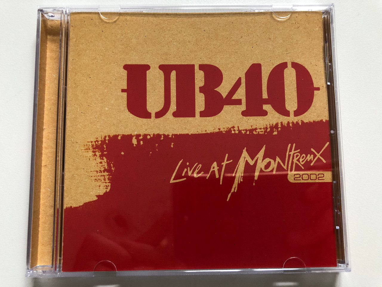 https://cdn10.bigcommerce.com/s-62bdpkt7pb/products/31039/images/182950/UB40_Live_At_Montreux_2002_Eagle_Records_Audio_CD_2007_EAGCD354_1__64345.1624958477.1280.1280.JPG?c=2