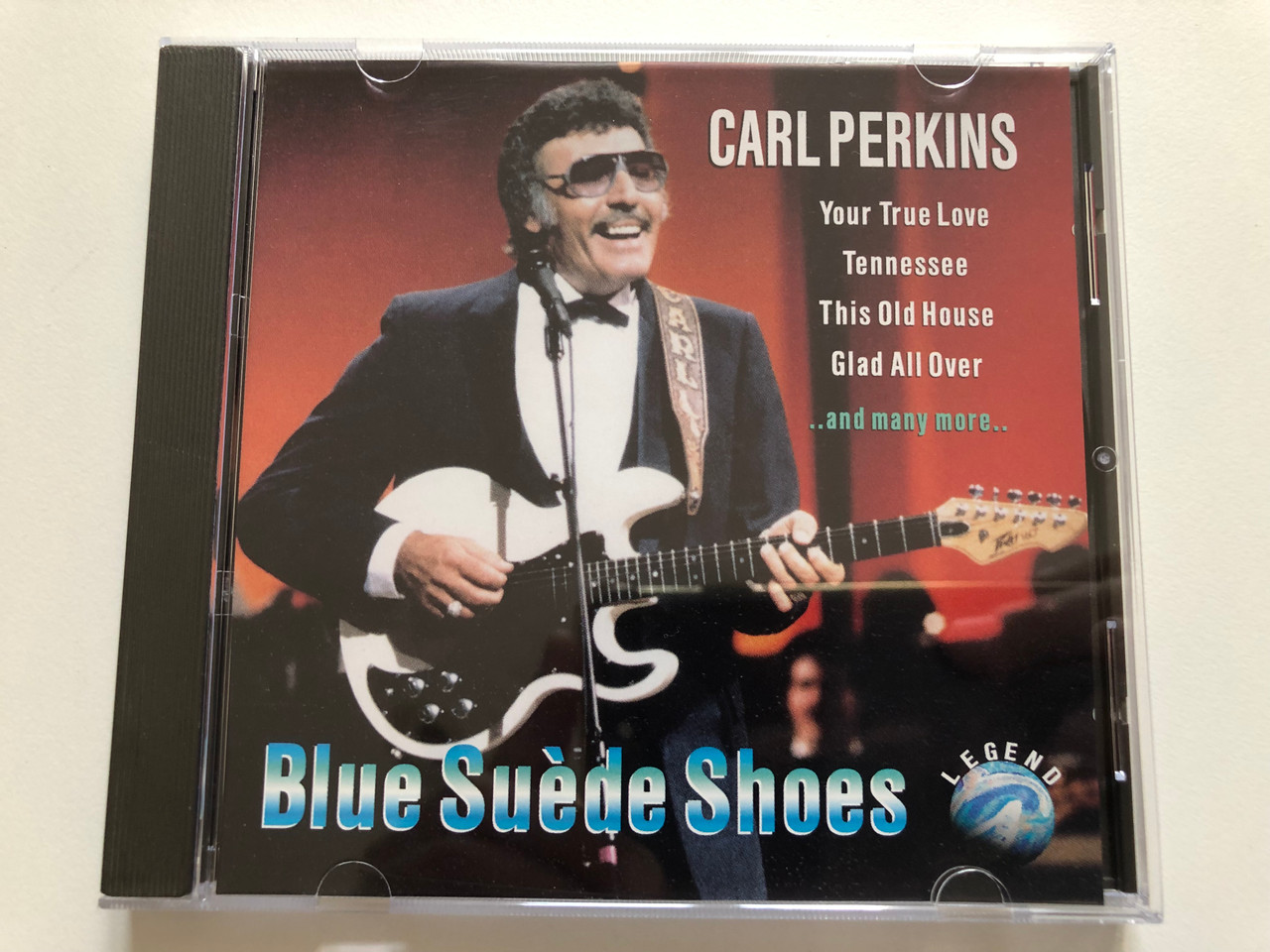 https://cdn10.bigcommerce.com/s-62bdpkt7pb/products/31051/images/183001/Carl_Perkins_-_Blue_Suede_Shoes_Your_True_Love_Tennessee_This_Old_House_Glad_All_Over_and_many_more_Legend_Audio_CD_1993_WZ_90087_1__01131.1625033762.1280.1280.JPG?c=2