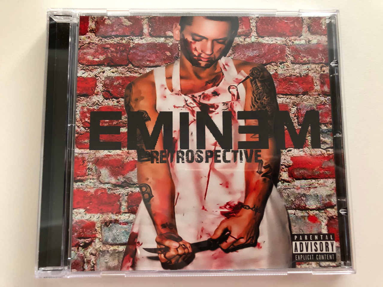 https://cdn10.bigcommerce.com/s-62bdpkt7pb/products/31115/images/183214/Eminem_Retrospective_Pacewell_Ent._Audio_CD_PWE018_1__73412.1625211631.1280.1280.JPG?c=2