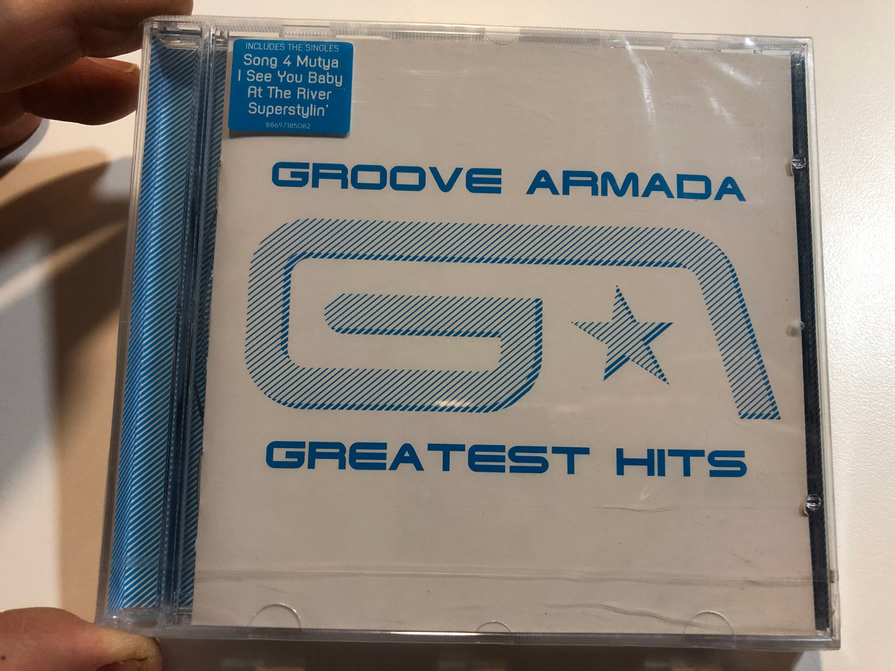 https://cdn10.bigcommerce.com/s-62bdpkt7pb/products/31119/images/183226/Groove_Armada_Greatest_Hits_Includes_The_Singles_Song_4_Mutya_I_See_You_Baby_At_The_River_Superstylin_Sony_BMG_Music_Entertainment_Audio_CD_2007_88697185082_1__19799.1625211625.1280.1280.JPG?c=2