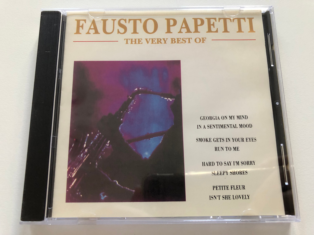 https://cdn10.bigcommerce.com/s-62bdpkt7pb/products/31160/images/183441/Fausto_Papetti_The_Very_Best_Of_Georgia_On_My_Mind_In_A_Sentimental_Mood_Smoke_Gets_In_Your_Eyes_Run_To_Me_Hard_To_Say_Im_Sorry_Sleepy_Shores_Petite_Fleur_Isnt_She_Lovely_Diamond_1__62605.1625585415.1280.1280.JPG?c=2