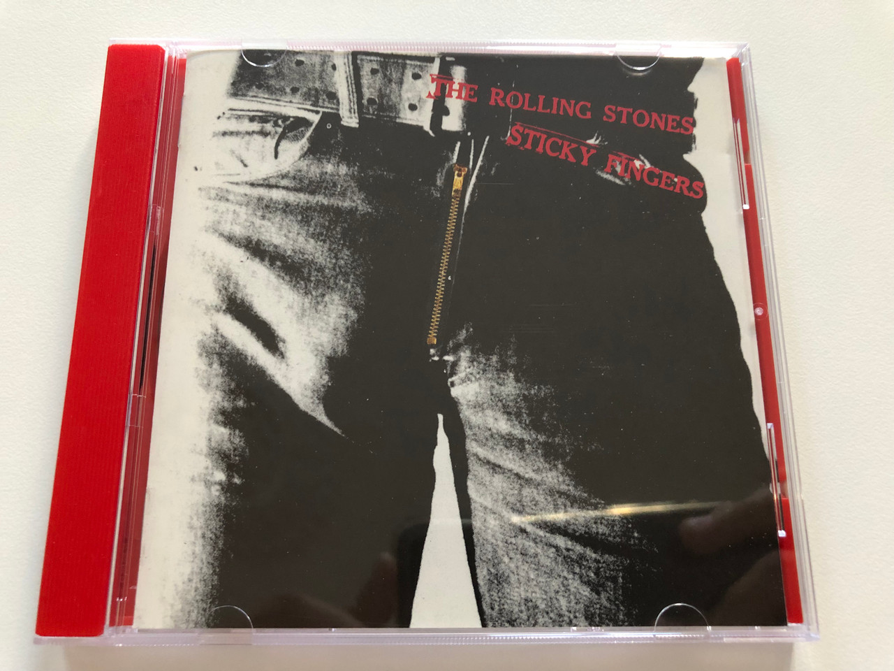 https://cdn10.bigcommerce.com/s-62bdpkt7pb/products/31167/images/183477/The_Rolling_Stones_Sticky_Fingers_Rolling_Stones_Records_Audio_CD_Stereo_CBS_450195_2_1__88516.1625591148.1280.1280.JPG?c=2