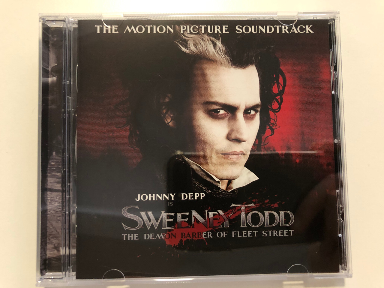 https://cdn10.bigcommerce.com/s-62bdpkt7pb/products/31227/images/183809/Johnny_Depp_Is_Sweeney_Todd_The_Demon_Barber_Of_Fleet_Street_Highlights_From_The_Motion_Picture_Soundtrack_Nonesuch_Audio_CD_2007_7559-79961-3_1__12928.1625740652.1280.1280.JPG?c=2