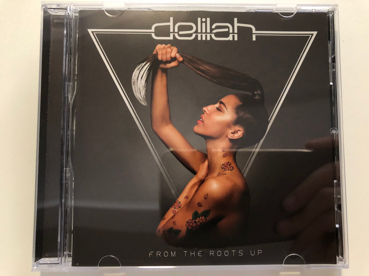 https://cdn10.bigcommerce.com/s-62bdpkt7pb/products/31231/images/183839/Delilah_From_The_Roots_Up_Atlantic_Audio_CD_2012_5053105018352_1__63353.1625743217.1280.1280.JPG?c=2
