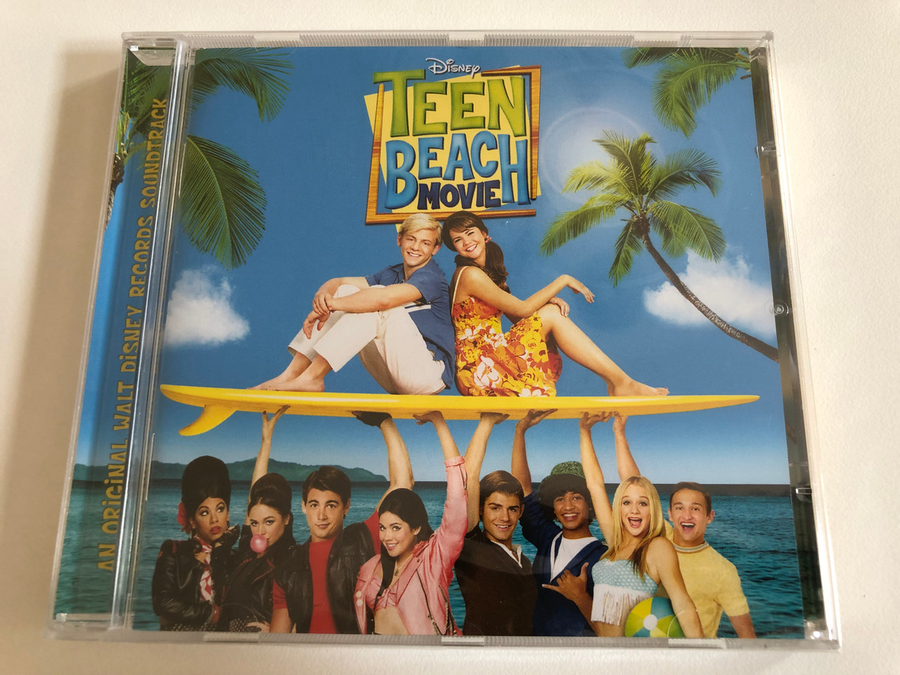 https://cdn10.bigcommerce.com/s-62bdpkt7pb/products/31451/images/184962/Disney_Teen_Beach_Movie_Walt_Disney_Records_Audio_CD_2013_0050087294229_1__86239.1626719262.1280.1280.JPG?c=2&_gl=1*19at0un*_ga*MjAyOTE0ODY1OS4xNTkyNDY2ODc5*_ga_WS2VZYPC6G*MTYyNjc3NzU1NS4zNi4xLjE2MjY3ODE0OTAuNjA.
