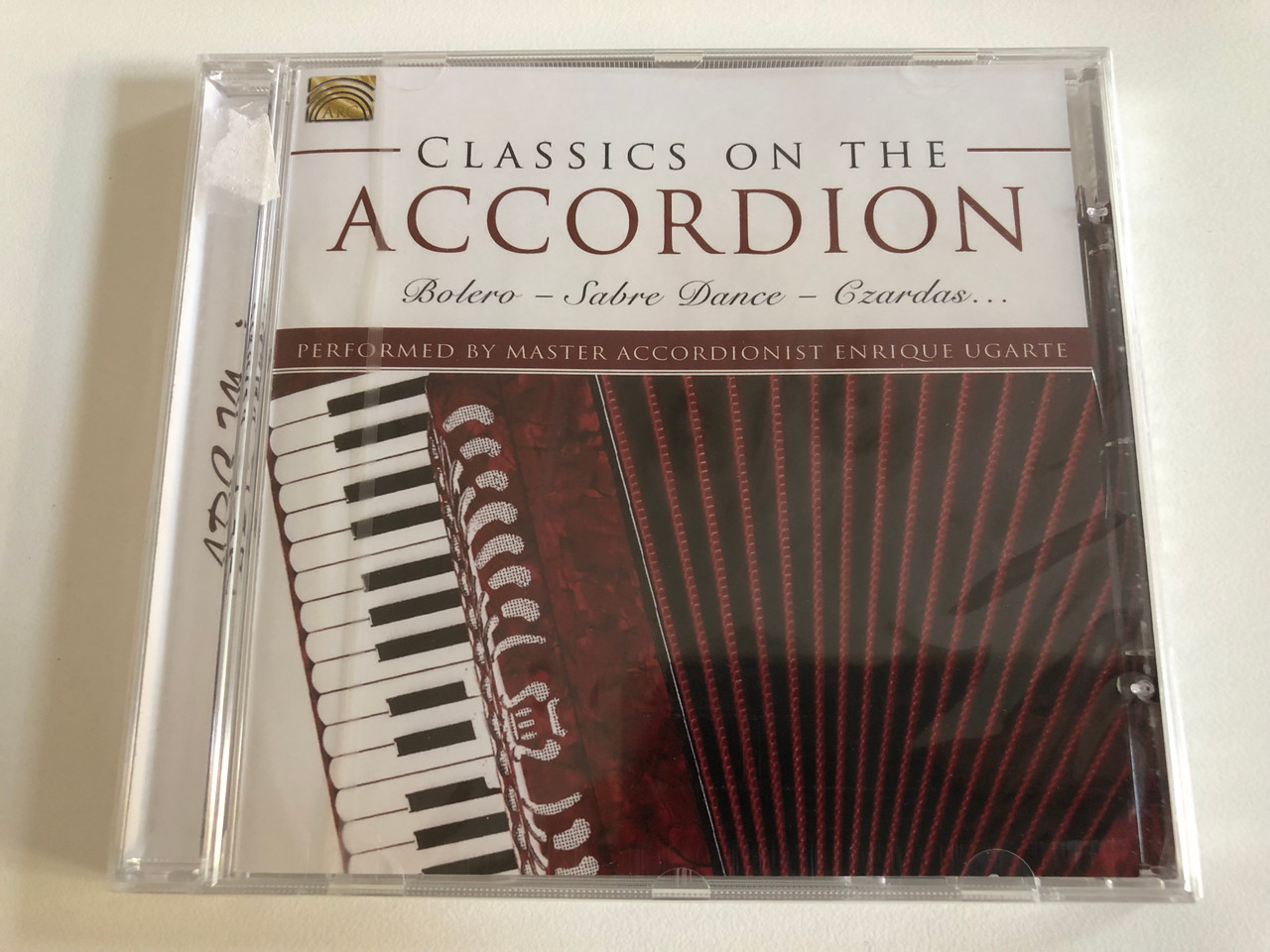 https://cdn10.bigcommerce.com/s-62bdpkt7pb/products/31529/images/185240/Classics_On_The_Accordion_-_Bolero_Sabre_Dance_Czardas_-_Performed_by_Master_Accordionist_Enrique_Ugarte_ARC_Music_Audio_CD_2001_EUCD_2650_1__96779.1626966837.1280.1280.JPG?c=2&_gl=1*1e1lz67*_ga*MjAyOTE0ODY1OS4xNTkyNDY2ODc5*_ga_WS2VZYPC6G*MTYyNjk2NzE2MS40OC4xLjE2MjY5Njc1MTkuNjA.