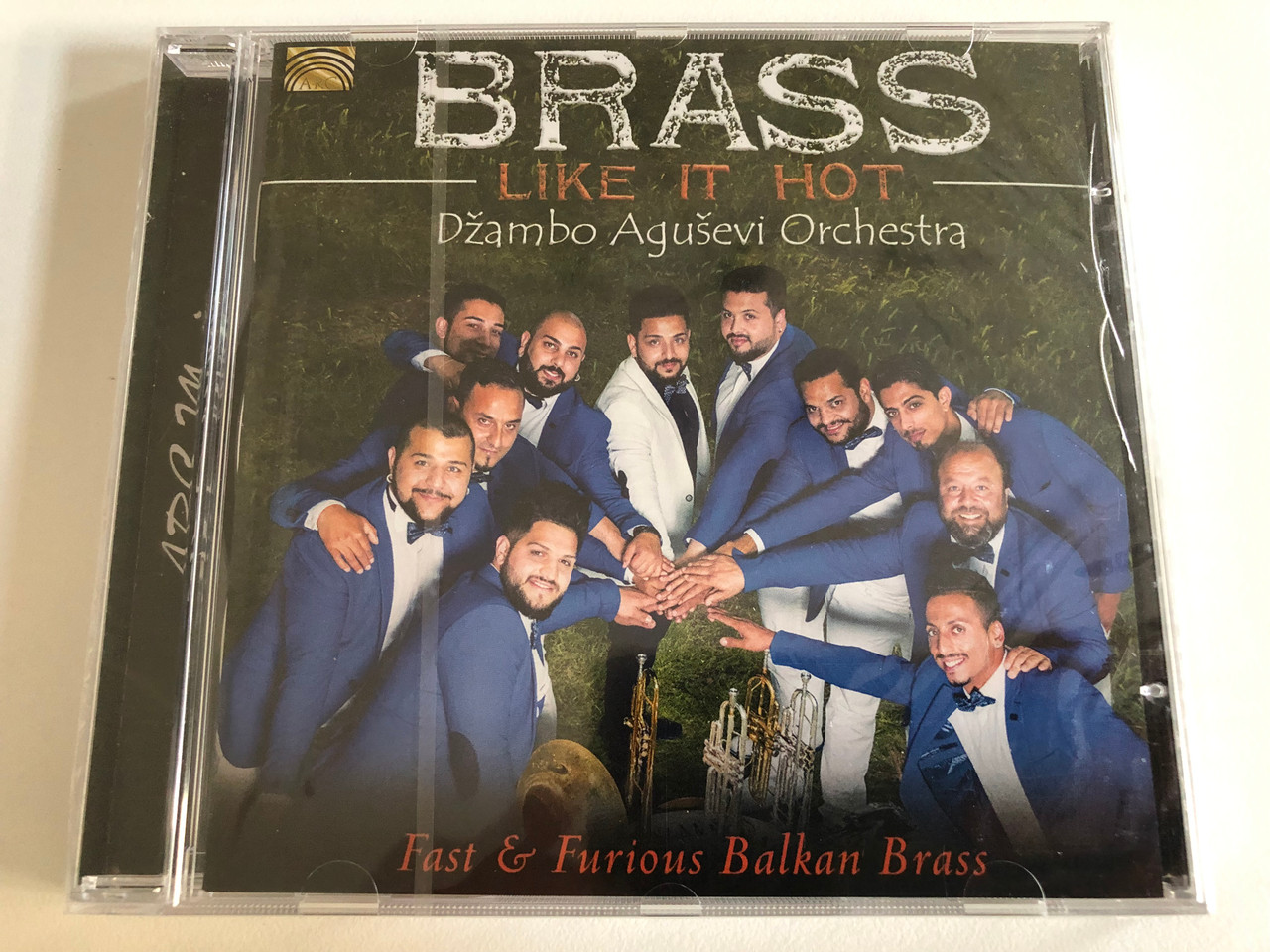 https://cdn10.bigcommerce.com/s-62bdpkt7pb/products/31533/images/185252/Brass_Like_It_Hot_-_Dambo_Aguevi_Orchestra_Fast_Furious_Balkan_Brass_ARC_Music_Audio_CD_2016_EUCD_2666_1__81859.1626969810.1280.1280.JPG?c=2&_gl=1*jl02y7*_ga*MjAyOTE0ODY1OS4xNTkyNDY2ODc5*_ga_WS2VZYPC6G*MTYyNjk3MzQ1My40OS4xLjE2MjY5NzM3ODkuNjA.