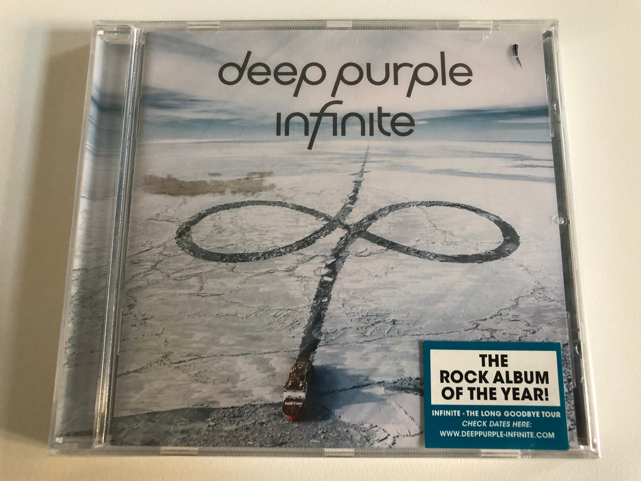 https://cdn10.bigcommerce.com/s-62bdpkt7pb/products/31572/images/185418/Deep_Purple_Infinite_The_Rock_Album_Of_The_Year_Infinite_The_Long_Goodbye_Tour_Ear_Music_Audio_CD_2017_0211848EMU_1__03298.1627046874.1280.1280.JPG?c=2&_gl=1*l4b5y1*_ga*MTg1NzIxNzgwNC4xNjI3MDYwODUy*_ga_WS2VZYPC6G*MTYyNzA2MDg1MS4xLjEuMTYyNzA2MTI5MC41Ng..