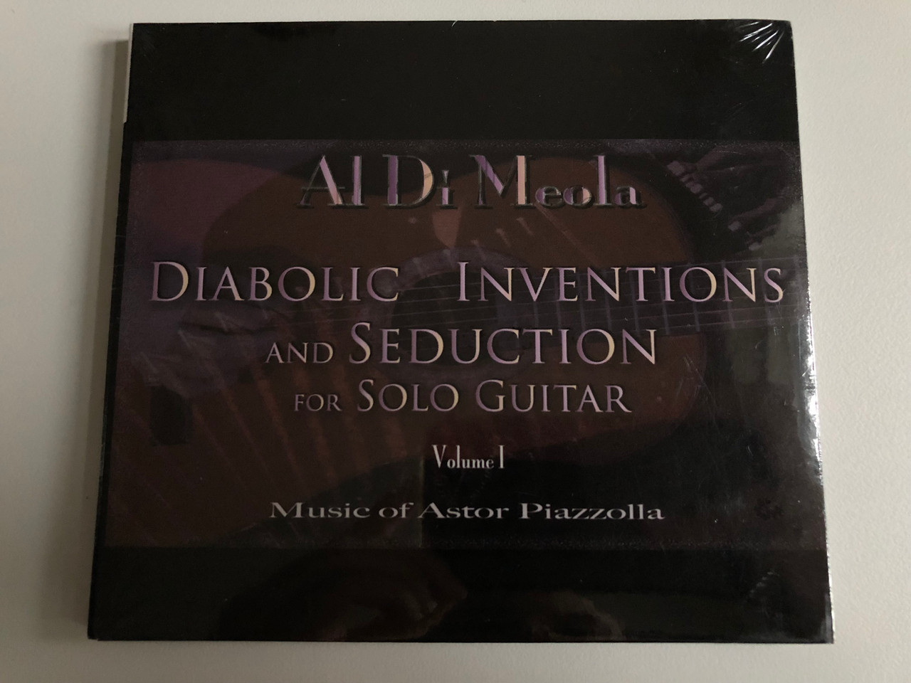 https://cdn10.bigcommerce.com/s-62bdpkt7pb/products/34753/images/202935/Al_Di_Meola_Diabolic_Inventions_And_Seduction_For_Solo_Guitar_-_Volume_I_Music_Of_Astor_Piazzolla_in-akustik_Audio_CD_2007_INAK_9080_CD_1__55770.1640339963.1280.1280.JPG?c=2&_gl=1*nwxw5v*_ga*MjA2NTIxMjE2MC4xNTkwNTEyNTMy*_ga_WS2VZYPC6G*MTY0MDMzOTQyOC4yMzIuMS4xNjQwMzQxMjM1LjI.