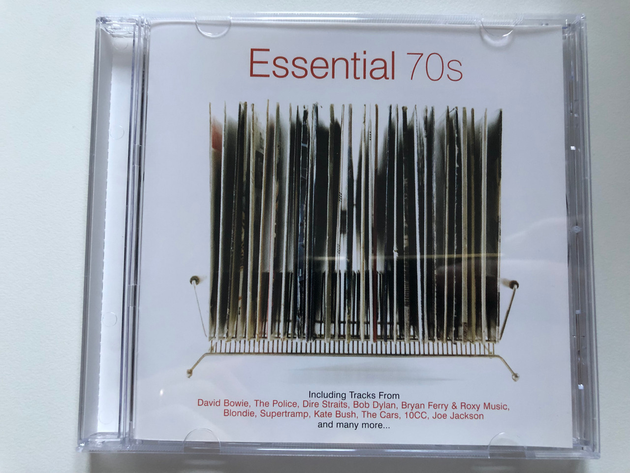 https://cdn10.bigcommerce.com/s-62bdpkt7pb/products/38805/images/214607/Essential_70s_Including_Tracks_From_David_Bowie_The_Police_Dire_Straits_Bob_Dylan_Bryan_Ferry_Roxy_Music_BlondieSupertramp_Kate_Bush_The_Cars_10cc_Joe_Jackson_and_many_more..._1__31272.1646151087.1280.1280.JPG?c=2&_gl=1*8959e9*_ga*MjAyOTE0ODY1OS4xNTkyNDY2ODc5*_ga_WS2VZYPC6G*MTY0NzA5MDMwMS4xMjQ1LjEuMTY0NzExMjE0NS41OQ..