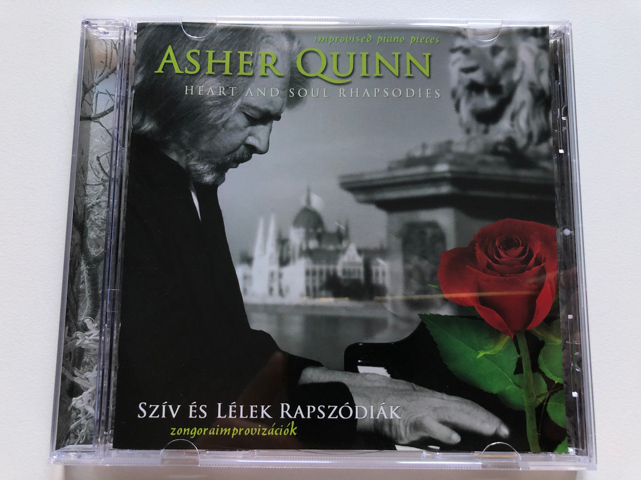 https://cdn10.bigcommerce.com/s-62bdpkt7pb/products/49449/images/252694/Asher_Quinn_-_Heart_And_Soul_Rhapsodies_improvised_piano_pieces_Sziv_Es_Lelek_Rapszodiak_-_zongoraimprovizaciok_Singing_Stone_Music_Audio_CD_SSM022_1__70558.1661790453.1280.1280.JPG?c=2&_gl=1*1j5nryd*_ga*MjA2NTIxMjE2MC4xNTkwNTEyNTMy*_ga_WS2VZYPC6G*MTY2MTc4MjI5Ny41NDEuMS4xNjYxNzkwMzYwLjU0LjAuMA..