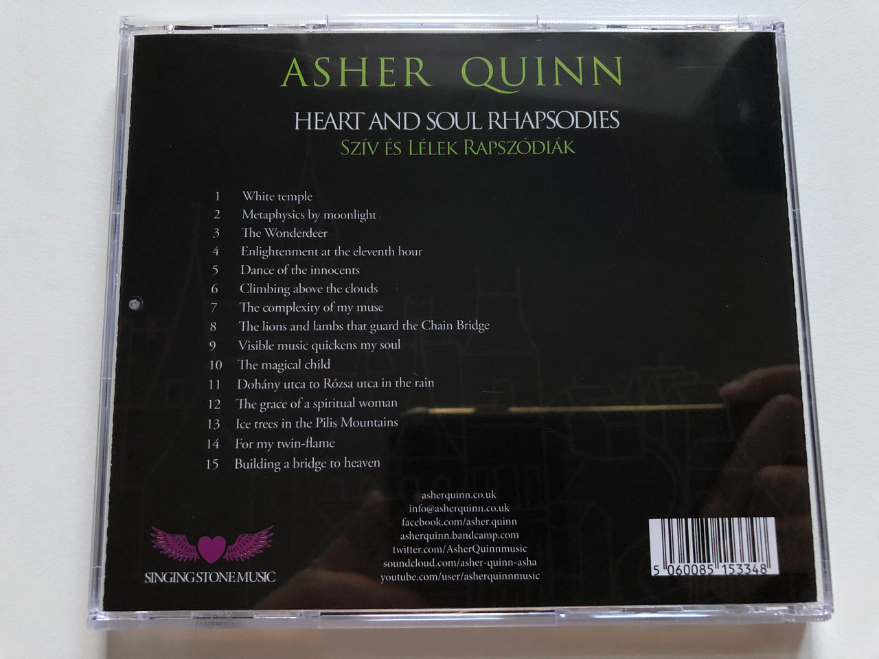 https://cdn10.bigcommerce.com/s-62bdpkt7pb/products/49449/images/252700/Asher_Quinn_-_Heart_And_Soul_Rhapsodies_improvised_piano_pieces_Sziv_Es_Lelek_Rapszodiak_-_zongoraimprovizaciok_Singing_Stone_Music_Audio_CD_SSM022_7__42261.1661790497.1280.1280.JPG?c=2&_gl=1*1j5nryd*_ga*MjA2NTIxMjE2MC4xNTkwNTEyNTMy*_ga_WS2VZYPC6G*MTY2MTc4MjI5Ny41NDEuMS4xNjYxNzkwMzYwLjU0LjAuMA..