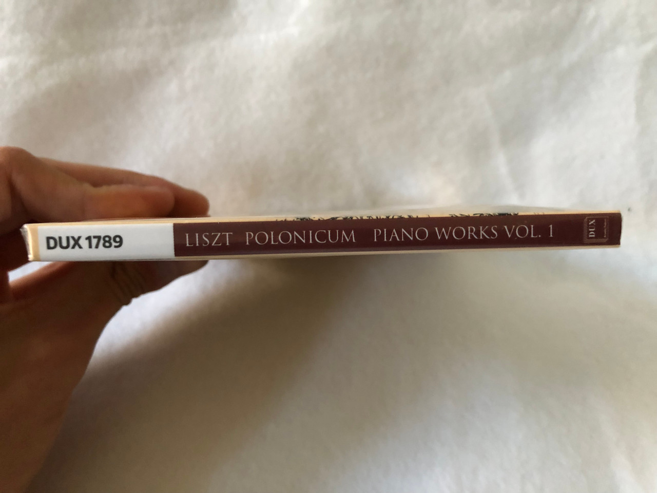 https://cdn10.bigcommerce.com/s-62bdpkt7pb/products/49883/images/254950/Liszt_Polonicum_-_Piano_Works_Vol._I_-_Tomasz_Kamieniak_piano_DUX_Recording_Audio_CD_2021_DUX_1789_3__36155.1664385988.1280.1280.JPG?c=2&_gl=1*1325vco*_ga*MjA2NTIxMjE2MC4xNTkwNTEyNTMy*_ga_WS2VZYPC6G*MTY2NDM4NTA3NC41NzEuMS4xNjY0Mzg2NTQ5LjI4LjAuMA..