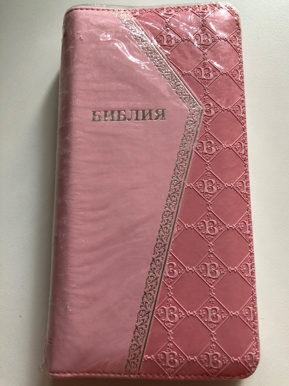 https://cdn10.bigcommerce.com/s-62bdpkt7pb/products/51414/images/261769/Russian_Pink_Holy_Bible_1__39979.1671717801.1280.1280.JPG?c=2