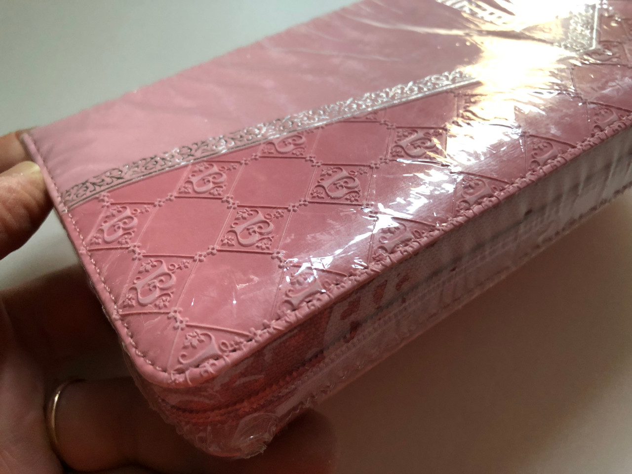 https://cdn10.bigcommerce.com/s-62bdpkt7pb/products/51414/images/261772/Russian_Pink_Holy_Bible_5__42932.1671717806.1280.1280.JPG?c=2