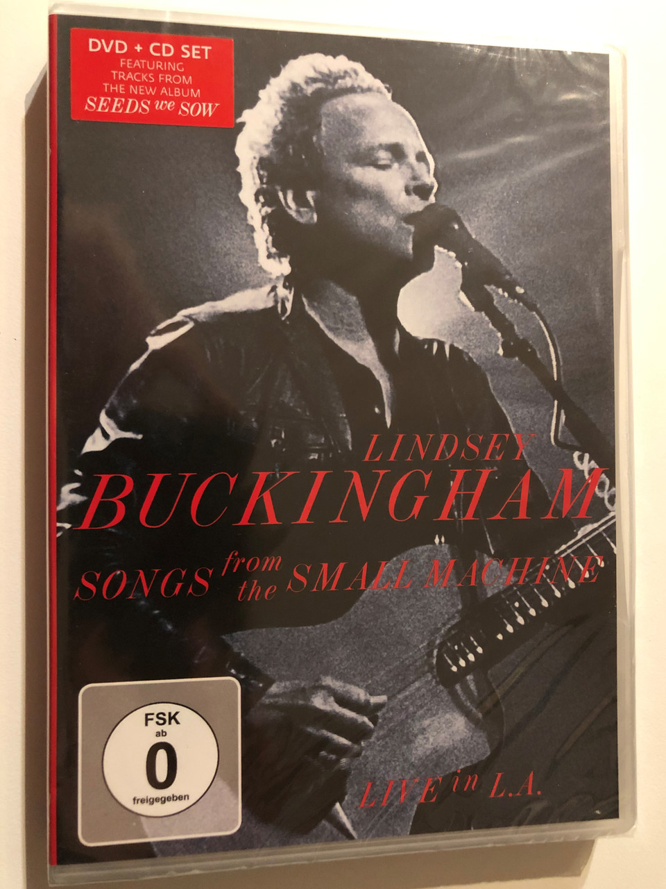 https://cdn10.bigcommerce.com/s-62bdpkt7pb/products/53438/images/271216/ongs_From_the_Small_Machine_Live_in_L.A._Lindsey_Buckingham_Actor_Direc__95474.1680095543.1280.1280.JPG?c=2&_gl=1*uzrndj*_ga*MzA5MjcwMDY5LjE2Nzk3NDk1MDE.*_ga_WS2VZYPC6G*MTY4MDA4OTM5MC40LjEuMTY4MDA5NTU1MS4xNy4wLjA.