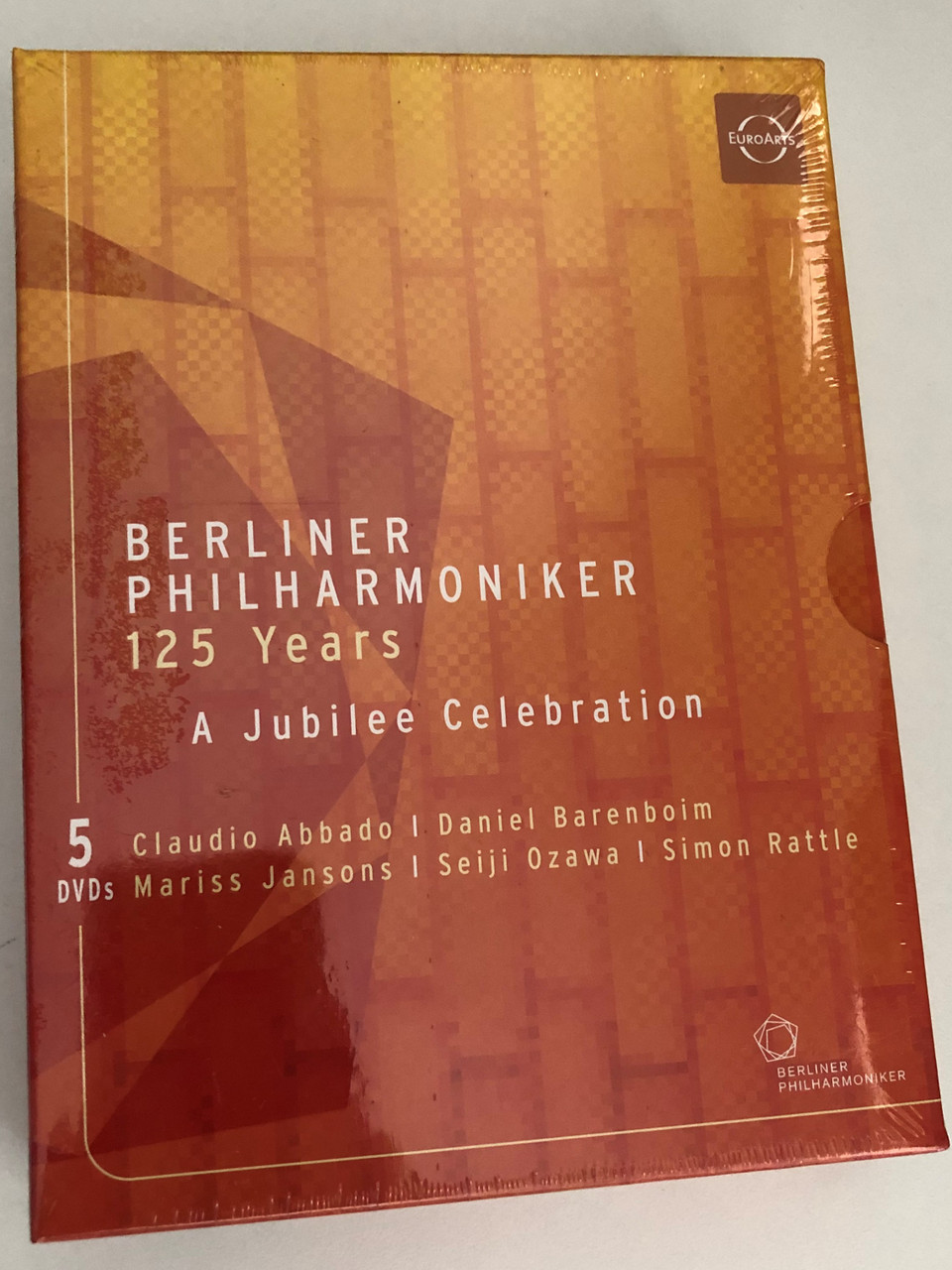 https://cdn10.bigcommerce.com/s-62bdpkt7pb/products/55170/images/277190/Berliner_Philharmoniker_125_Years_-_A_Jubilee_Celebration_Berlin_Philharmonic_5_DVD_Set_Abbado_Barenboim_Jansons_Ozawa_Rattle_DVD_880242000682__22342.1687236410.1280.1280.JPG?c=2