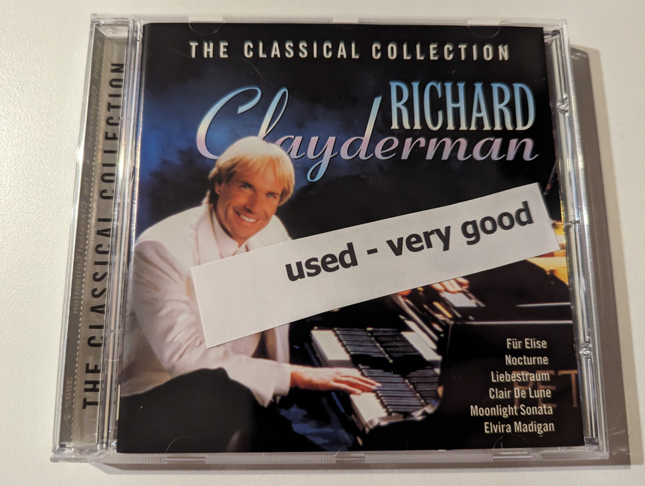 https://cdn10.bigcommerce.com/s-62bdpkt7pb/products/56245/images/282759/Richard_Clayderman_The_Classical_Collection_-_Fr_Elise_Nocturne_Liebestraum_Clair_De_Lune_Moonlight_Sonata_Elvira_Madigan_CMC_Music_Audio_CD_1995_3002-2_16__34777.1689059284.1280.1280.jpg?c=2&_gl=1*con99m*_ga*MjA2NTIxMjE2MC4xNTkwNTEyNTMy*_ga_WS2VZYPC6G*MTY4OTA0OTcyMi45ODIuMS4xNjg5MDU5MjE2LjU5LjAuMA..