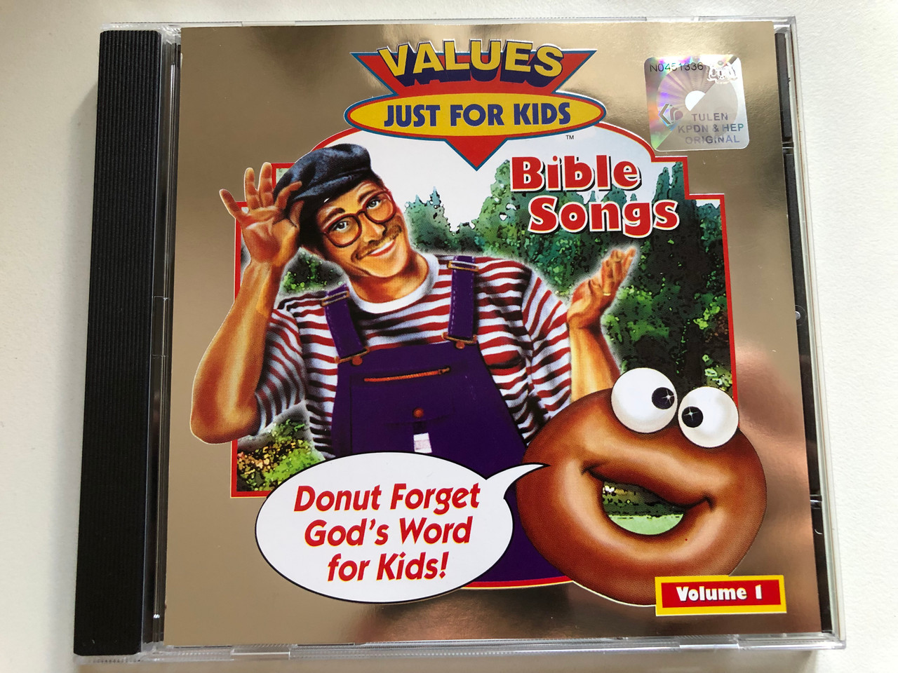 https://cdn10.bigcommerce.com/s-62bdpkt7pb/products/57273/images/289894/Donut_Man_Bible_Songs_Volume_1_1__22605.1691101793.1280.1280.JPG?c=2&_gl=1*10x2ok6*_ga*MjAyOTE0ODY1OS4xNTkyNDY2ODc5*_ga_WS2VZYPC6G*MTY5MTA4ODQ3MS4zNTg1LjEuMTY5MTEwMTkzNC42MC4wLjA.