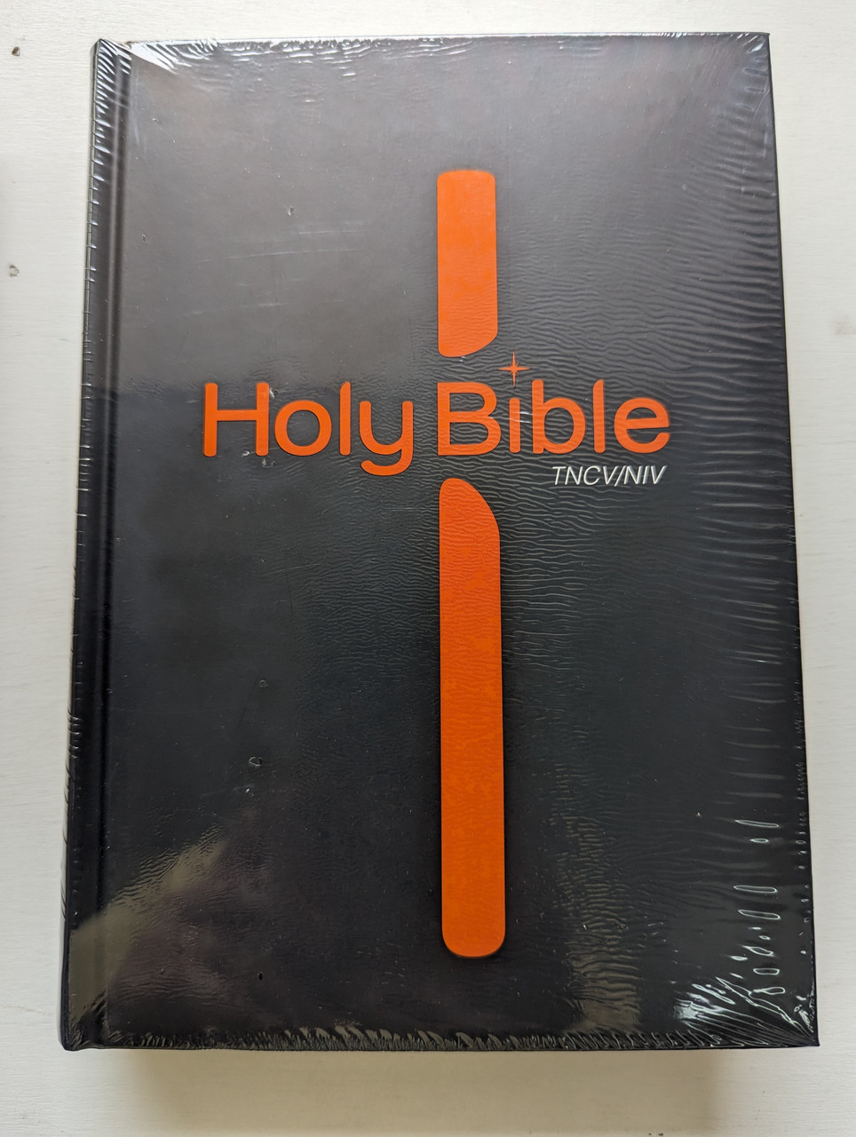 https://cdn10.bigcommerce.com/s-62bdpkt7pb/products/5754/images/311895/Thai_-_English_Bible_Bilingual_Diglot_Orange_Cross_Large_Size_1__15308.1699815768.1280.1280.jpg?c=2