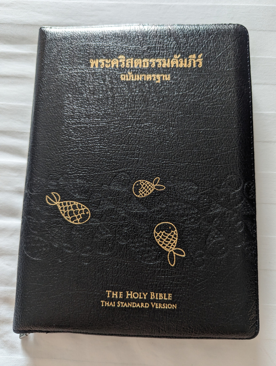 https://cdn10.bigcommerce.com/s-62bdpkt7pb/products/7535/images/311938/Thai_Standard_Version_THSV_Holy_Bible_Zippered_Black_Leather_with_Thumb_Index_1__47381.1699822551.1280.1280.jpg?c=2