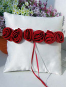 white wedding ring pillow with red rose