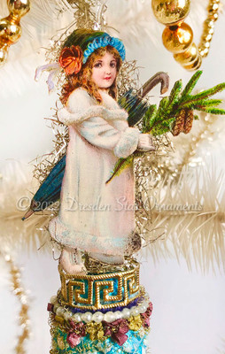 Girl in Winter Cloak Holding Pine Branch on Frosted Blue Pinecone 