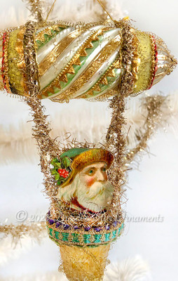 Santa with Green Cap and Holly Riding on Fanciful Silver Green and Gold Dirigible