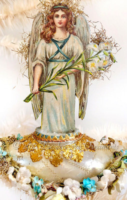 Easter Angel with Lilies on Silver Glass Boat Rimmed with White Roses and Forget-Me-Nots