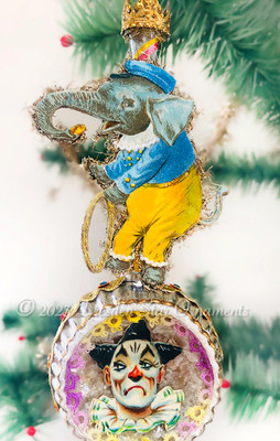 Performing Baby Elephant Balancing on Amazing Reflector Ornament with Clown Theme