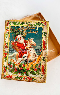  Santa with Toys and Rocking Horse on Decorated Poinsettia Candy Box 