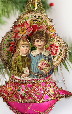Boy and Girl Diorama Ornament With Fancy Latticework on Magenta Glass Basket