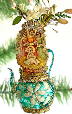 Baby Jesus with Angel Trio on Blue Glass Urn ornament with Flowers