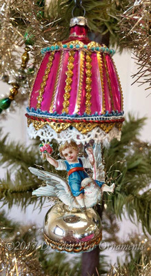 Reserved for Jennifer – Child Riding Dove on Pink Glass Lantern Ornament 