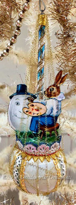 Artist Rabbit Decorating Egg on Antique Pastel Blue Sphere Ornament