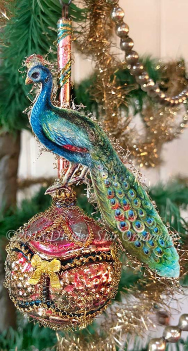 Delicate Peacock Posed on Antique Molded Pink Ornament - Dresden Star ...