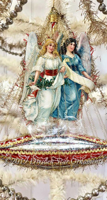 Twin Christmas Angels on Red and Silver Glass Ship Surrounded by Sparkly Tinsel