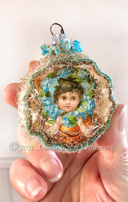 Victorian Child in Antique Bumpy Glass Indent decorated with Tiny Blue Fabric Flowers and Delicate Glass Beadwork