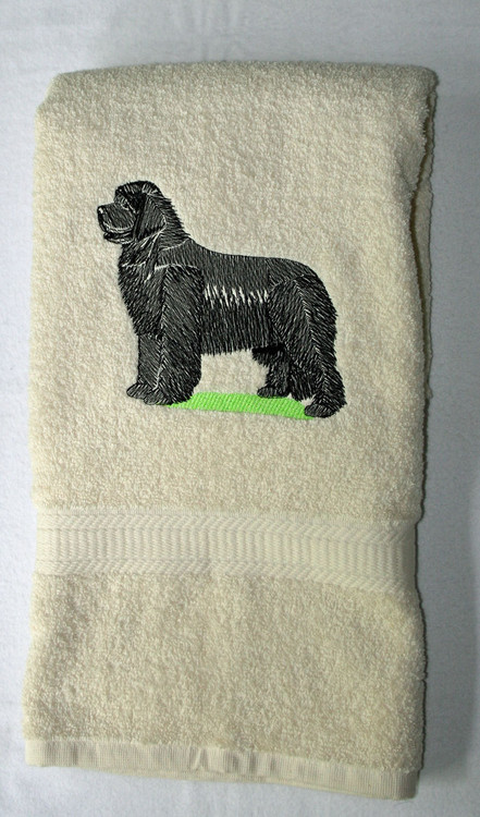 Black newf on cream bath towel