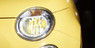 Closeup view of a vehicle installed Philips Yellow Color Vision halogen bulbs 3350K 12972CVPYS2 H7