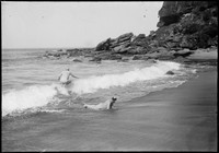 Two Macpherson brothers bodysurfing at Woy Woy.