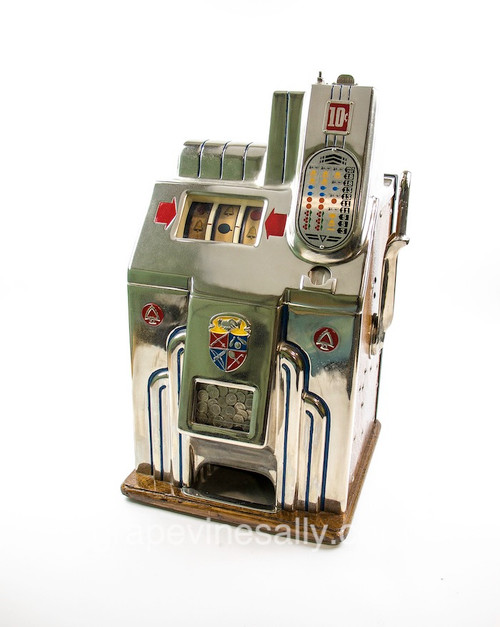 This is a RESTORED and working 1938 vintage MILLS Slot Machine. It works beautifully and been recently restored. Very nice all original condition. Rear panel locking key included. 

MEASUREMENTS:

H 28"  /  W 16"  /  D 15.5"

No Shipping. These machines are very heavy, you are welcome to pick up at our Ventura shop. Call for appointment.
