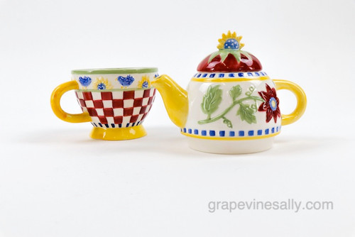 Vintage Three Piece Colorful Ceramic Tea Pot with Matching Cup  - very nice condition. 

MEASUREMENTS: Overall Height 7-3/4  /  Cup Height 3-3/4" / At center Width including Handles 7-3/4"