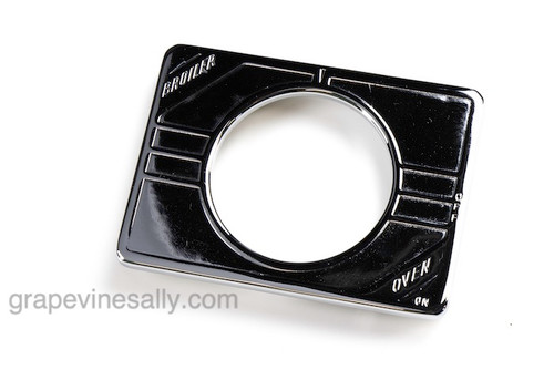 1930's - 1940's Vintage NEW CHROMED Magic Chef Stove 'Oven' Dial Trim Plate - This trim plate is embossed with 'Oven' & 'Broil'  lettering in the corners.

MEASUREMENT: Width: 3-3/4"   /   Height: 2-3/4"

 
