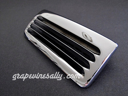 Vintage OKeefe & Merritt stove original NEW CHROME stove top vent. This is the OK&M style vent with the thin fins, with 1 center REAR PEG. Fits the vintage 1940's - 1950's O'Keefe & Merritt stoves.

MEASUREMENTS: 
Exterior Width: 6-1/8"  /  Exterior Depth: 2-1/2"

Backsplash Vent Hole Opening: 5-1/4" Width x 1-1/8" Depth