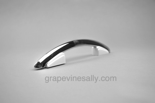 PLEASE READ FULL DESCRIPTION. Original NEW CHROMED Vintage Western Holly Gas Stove 11" Oven Door & Drawer Handle. Note the white plastic/bakelite trim has a couple of slight chips on the underside where the small 'end tips' have broken as it often does on this style of handle. They are on the underside of the handle so they are less noticeable. Pristine handle are also available in the store.  Fits the vintage 1940's - 1950's Western Holly Mid-Century Stoves. These handles are an extremely rare find in this condition. 

Also available in the store are new chromed 'tear drop' trim that mounts between handle and door. (a pack of 8)

MEASUREMENTS: Overall Length - 11.0" / Screw Mounting Holes - 5.5" (on center)

All of our new chromed parts are 'Triple Plated' (copper, nickel, chrome)